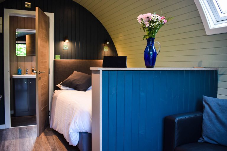 Our Pods have double beds and a seating area